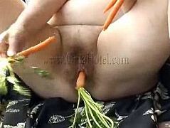 Granny Rose is in her balcony and the fresh air made her feel a bit better. Now that she feels good she wants to play with herself and begins touching that fat belly and her saggy cunt. Luckily Rose has a few carrots and we all know how important vegetables are for old people. She takes the carrots and fill her pussy
