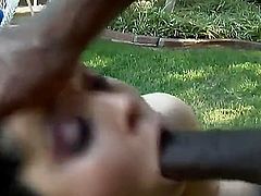 Extra huge black cock is penetrating Amber Skys tight and wet mouth, she is doing a good blowjob and is being fucked deep and hard in her wet and trimmed pussy by a black dude outdoors.