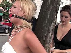 Salacious blonde Angelic is havimg fun with a few guys outdoors. They tie Angelic up, rub her tits and pussy and then fuck her snatch remarcably well.