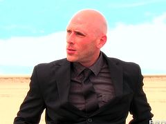 Johnny Sins is in a coma. When milf doctor Rachel Starr comes to check on him her imagines he's fucking her out in the middle of nowhere. He sucks her tits and she gives him a nice two-handed handy in the desert.