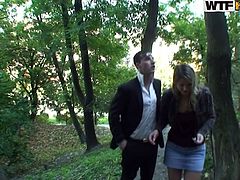 Aroused couple of newlyweds take a stroll at the park when an insatiable hubby forces his wifey to give him a head right at the street.