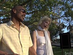 Sex greedy black dude picks up a spoiled blond hussy in the street. He invites her home where she inclines to oral fuck his long thick dick while he speaks on the phone.