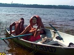 Tasty looking Russian brunette slut lays on her back in a boat her mouth and shaved pussy get fucked by two insatiable dudes simultaneously in steamy threesome sex video by WTF Pass.