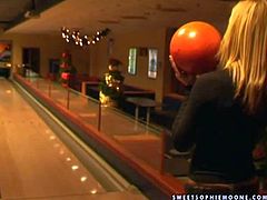 Gorgeous and sexy blonde lesbian babes Wivien and her friend enjoy in teasing the boys with their hot bodies as they play with balls in the bowling room and have fun