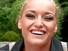 Kathia Nobili is a beautiful blond- haired european pornstar that gives interview for the camera in the back garden and then flashes her amazing tits with smile on her face.