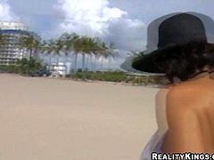 Dark haired woman in black and white bikini gets picked up by MILF Hunter on the beach. They have a great time together. He touches her boobs in public place curiously. Watch her get seduced!