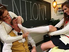Take a look at this foot fetish scene where these two hotties have a great time having their feet worshiped by their teacher in the middle of class.