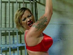 Rope bound prisoner Pamela in red lingerie gets her nice ass spanked with no mercy by blonde domina Kathia Nobili behind the bars. Watch juicy ass lesbian prisoner get punished.