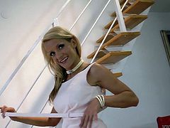 She is seductive blonde mom having killer body. She poses on cam demonstrating her goodies. Then she takes her clothes and places on a couch caressing herself.