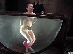 After some toying and bondage fun, it's time to torture Katja Kassin first with a strong stream of water aimed at her and then by submerging her in a big bowl.
