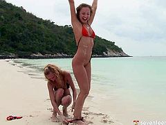 Two mind taking blond babes in steamy tiny bikinis goof around at the beach rubbing over each other's steamy bodies. They continue caressing each other on the yacht in steamy lesbian sex video by Club Seventeen.