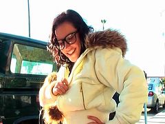 Cute girl in glasses shows her tits in public