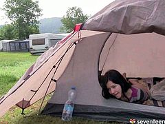 This cute 17 year old girl is half naked inside her tent. She is rubbing her pussy until she has an intense orgasm.