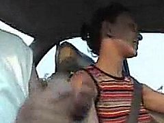 Girl stroking cock in a car