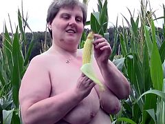 Redneck whore Tina is one of those bbw with a lot of lust. She's in the corn field and starts acting naughty. Her big, fat pussy needs some fucking and because there's nobody around Tina grabs a corn and fills her vagina. The fucking whore needs more then that, let's see if she will get some hard cock