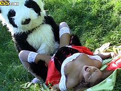 Slutty babe enjhoys feeling huge panda's cock stroking her in outdoor hardcore
