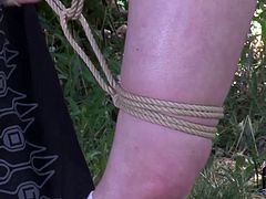 She is slutty bitch with big boobs and fat white ass. She loves restraint sex games so she enjoys being hogtied and hanged down the tree. Perverted slut in DDF Network porn video.