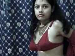 Brunette woman is indescribably seductive. She lies in front of cam wearing red traditional style dress. She caresses her sexy body revealing her privates.