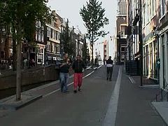 Two dudes from Finland go to the Red Light District. They go to the brothel and while one tapes everything on cam, spoiled slim ugly blondie in red lingerie rubs her wet pussy and provides one of the dudes with a handjob.