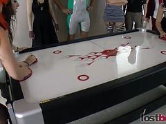 Aubrey, Belle, Cherry and Devon play air hockey. Whoever loses must take off a piece of clothing and continue the game.