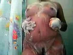 Amateur BBW takes a shower on cam and rubs her soapy pussy passionately