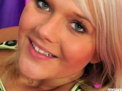 Flirty blond cutie strips in front of cam like a professional stripper before she lies to rub her aroused vagina with fingers in peppering sex clip by My Sexy Kittens.