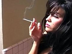Superb brunette smokes in solo