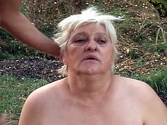 Watch this fat granny in this outdoor old and young video, where you will see her bending down and sucking a big fat cock and taking it like a real slut.