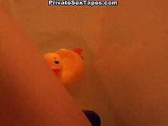 Hot chick gives a good footjob in the bathtub
