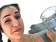 Sasha Grey drinks her own pee and you can see her gorgeous little feet and toes.