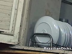 Horny brazilian guys get into the kitchen room to satisfy their hunger. Cum and watch as this horny latino gets on his knees to suck this hunk's big hard cock!