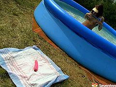 Fuckable brunette Russian amateur is having fun in the inflatable pool. Later she gets out soaking wet to keep having fun by stroking her bald pussy with manicured fingers and later poke it with dildo.