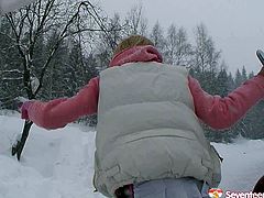 Stupid blond student has a total absence of brain as she steps outdoor in snowy weather in mini skirt to poke her shaved cunt with metal dildo.