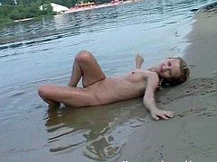 Jena the skinny blonde poses naked by the lake