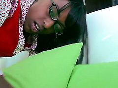 Stunning ebony babe with glasses Passion is munching on a bearded dudes hard dick. After she has sucked him well she receives his boner from behind.