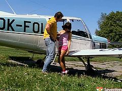 Nasty brunette serves pilot at the highest level. She swallows his dick greedily and jerks off his dick from time to time. Later he drills her pussy in doggy style.