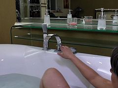 Check out my naughty slut Enrica. This mature whore can behave even when she's in the bathtub. Enrica slowly rubs her body with that bath sponge. Yeah she likes that and massages her tits, belly and those hot thighs. Let's see if she's gonna pay some attention to that muffin between her thighs.