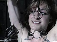 Naughty Stacey Stax gets bounded and gagged. She also gets her tits tortured with weight fixes to her nipples. After that she gets covered with hot wax and toyed in her wet pussy.