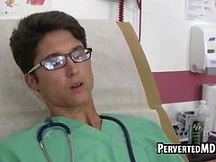 Hot stud tugs on his cock while getting toyed by his doc
