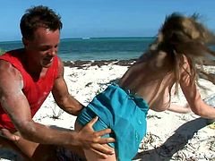 Slutty chick arra White is getting naughty with some guy on a beach. She gives him a blowjob and then they fuck in side-by-side and other positions on the sand.