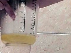This skanky girl is wacky whore. First, she gets pleased with sex toys in the bathroom. Then she is pissing in a bawl filling it to the half. Later she overturns the bawl onto herself taking golden shower. She is glazed with her own urine.
