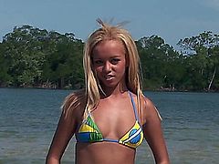 Barbie Banks is enjoying the warm water at the beach, when approached by a couple of nude guys, who ask if she'd like to participate in a hardcore threesome. She agrees, giving one man a reverse handjob, while giving the other man a blowjob. Soon, this natural boobed beauty is getting a DP followed with more handjobs for facial cumshots.