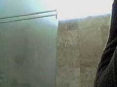 Brunette masturbating in shower