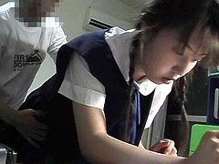 Check out this horny Japanese teenie having fun in her dorm room. She gave him some head and then took his schlong from behind like a champ!