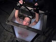 This horny siren is going through some painful things! She gets tied up and tortured a bit. Then her master puts her inside the immersion tank full of water!