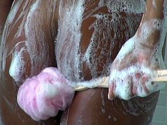 Steamy busty Latin MILF fucks her punani with dildo while taking a shower