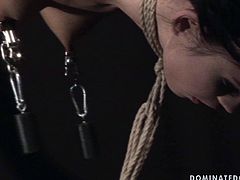 Worn out brunette doxy with a soaking make up gets her tits and hands tied before she inclines to give a blowjob to strain dick. Later he pins her nipples with metal pegs attached to the floor in sick BDSM-involved sex video by 21 Sextury.