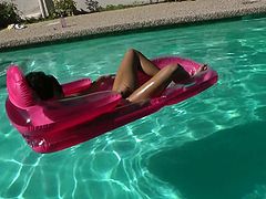 Dazzling brunette chick demonstrates her body posing in front of camera. She stretches her pussy lips with fingers showing off her depth closeup. Then she bathes in the pool pleasing her pussy with fingers.
