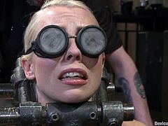 Sexy blonde chick gets tied up and gagged. She also gets her shaved pussy drilled deep by her inventive master.