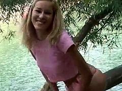 Insolent blonde teen feels horny and in need to pose her forms in outdoor solo